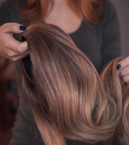 closeup shot of a hair wig in the hands